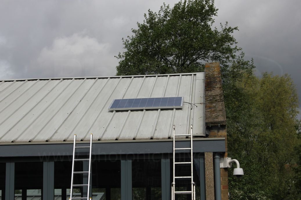 Installation of a 250W solar panel on commercial building